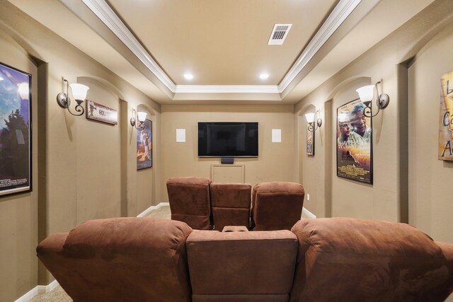3225 Summer Tanager Ln, Manvel, TX 77578 - carpeted home theater with arched walkways, ornamental molding, a tray ceiling, baseboards, and recessed lighting