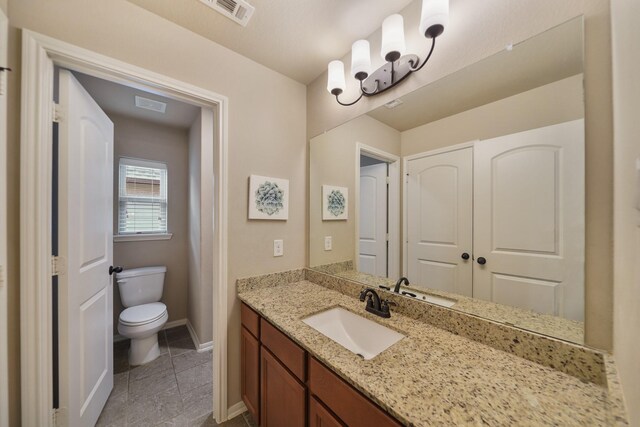 3225 Summer Tanager Ln, Manvel, TX 77578 - bathroom with vanity, toilet, baseboards, and tile patterned flooring