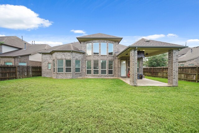 3225 Summer Tanager Ln, Manvel, TX 77578 - back of property with a patio area and brick siding