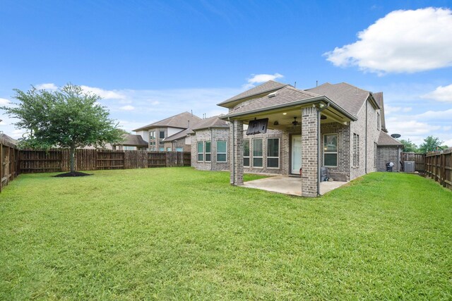 3225 Summer Tanager Ln, Manvel, TX 77578 - rear view of house with a ceiling fan, a patio area, brick siding, a shingled roof, and central AC unit