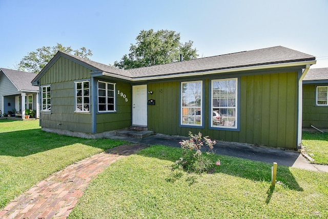 1905 Tennessee St, Baytown, TX 77520 - single story home with a front yard and roof with shingles