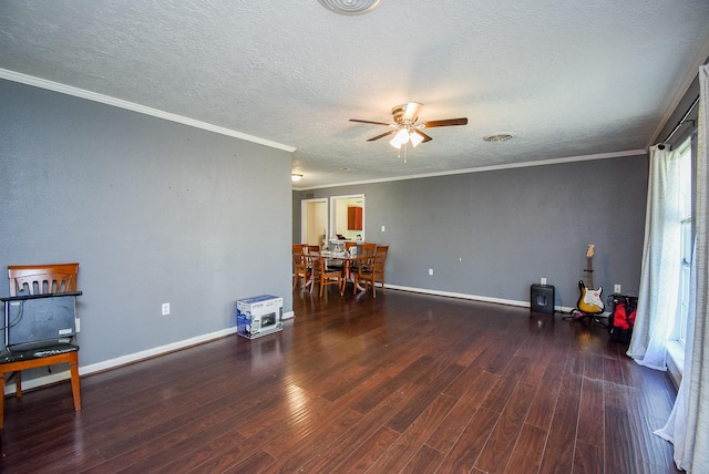 1905 Tennessee St, Baytown, TX 77520 - living area featuring a textured ceiling, a ceiling fan, ornamental molding, and wood finished floors