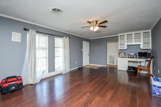 1905 Tennessee St, Baytown, TX 77520 - unfurnished living room featuring ornamental molding, a textured ceiling, a ceiling fan, visible vents, and wood finished floors