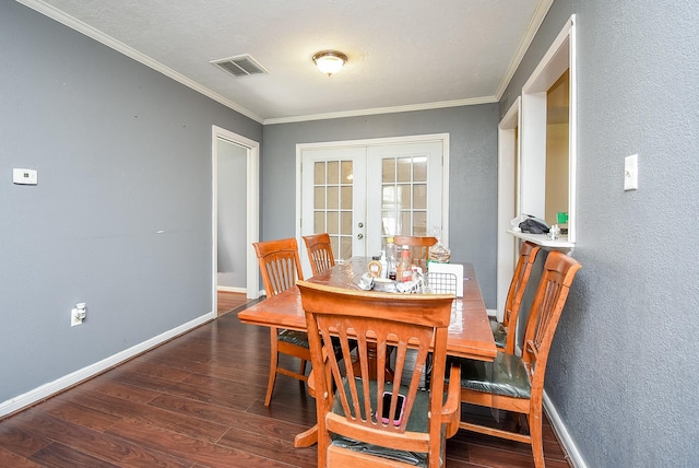 1905 Tennessee St, Baytown, TX 77520 - dining area with visible vents, baseboards, crown molding, wood finished floors, and french doors