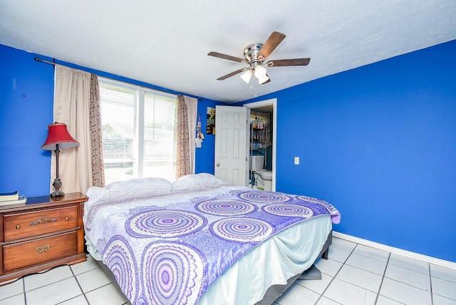 1905 Tennessee St, Baytown, TX 77520 - bedroom with a ceiling fan, baseboards, and tile patterned flooring