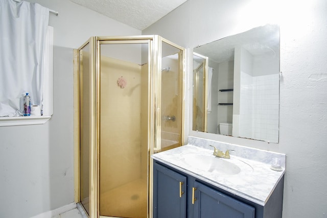 1905 Tennessee St, Baytown, TX 77520 - full bath featuring toilet, a stall shower, vanity, and a textured ceiling