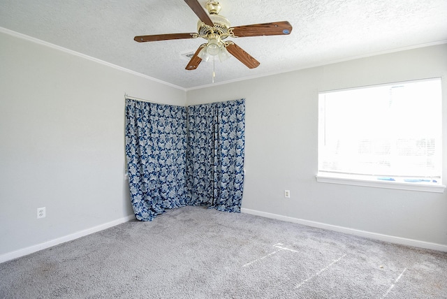 1905 Tennessee St, Baytown, TX 77520 - empty room featuring baseboards, a textured ceiling, crown molding, ceiling fan, and carpet