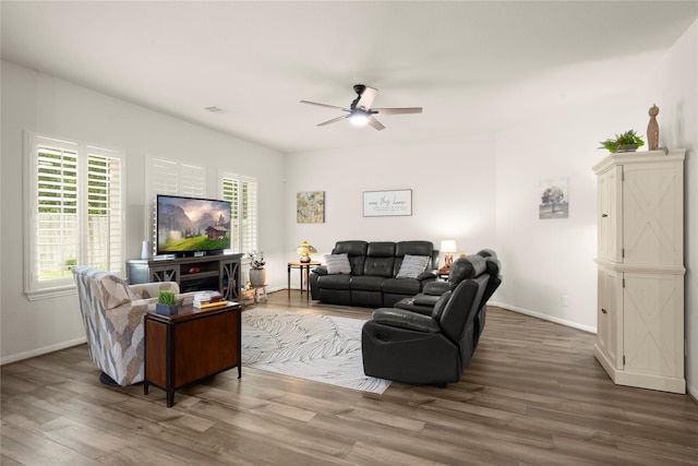 1143 Grand Junction Dr, Tomball, TX 77375 - living room featuring wood finished floors, a ceiling fan, and baseboards