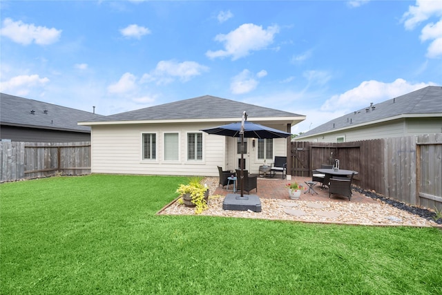 1143 Grand Junction Dr, Tomball, TX 77375 - rear view of house featuring a fenced backyard, a patio, and a lawn