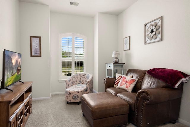 1143 Grand Junction Dr, Tomball, TX 77375 - living area featuring light colored carpet, baseboards, and visible vents