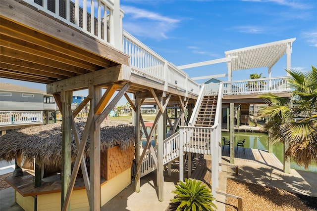 206 China Clipper Dr, Freeport, TX 77541 - view of patio with a dock and stairway