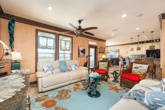 206 China Clipper Dr, Freeport, TX 77541 - living room with a ceiling fan, ornamental molding, visible vents, and recessed lighting