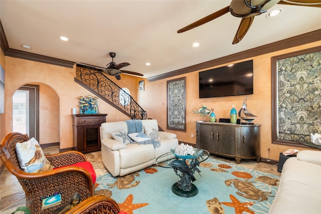 206 China Clipper Dr, Freeport, TX 77541 - living room featuring baseboards, recessed lighting, a ceiling fan, crown molding, and arched walkways