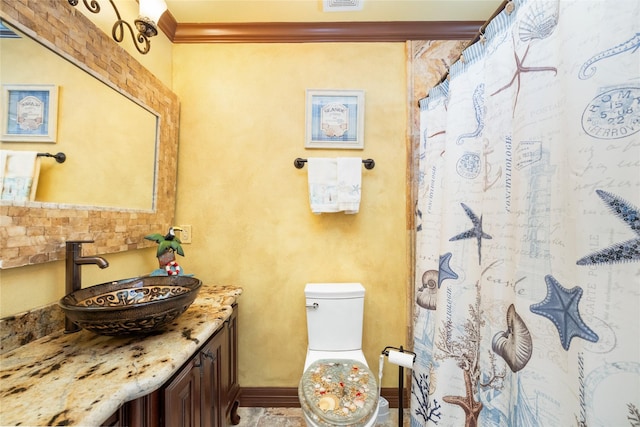 206 China Clipper Dr, Freeport, TX 77541 - bathroom with visible vents, baseboards, toilet, crown molding, and vanity