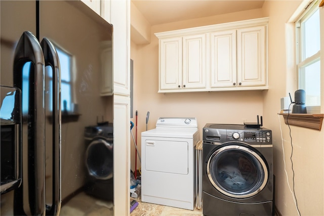 206 China Clipper Dr, Freeport, TX 77541 - laundry room featuring washing machine and clothes dryer and cabinet space