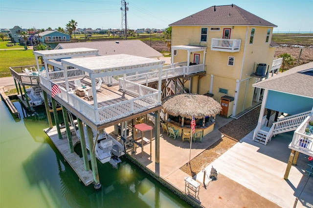 206 China Clipper Dr, Freeport, TX 77541 - view of dock featuring a water view, central AC unit, and boat lift