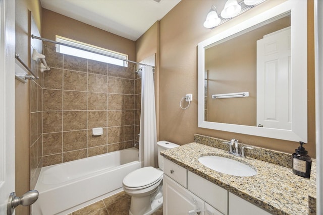 bathroom featuring shower / bath combo, toilet, vanity, and tile patterned floors