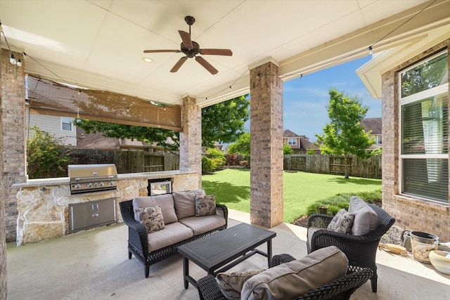view of patio with outdoor lounge area, a fenced backyard, a grill, exterior kitchen, and ceiling fan