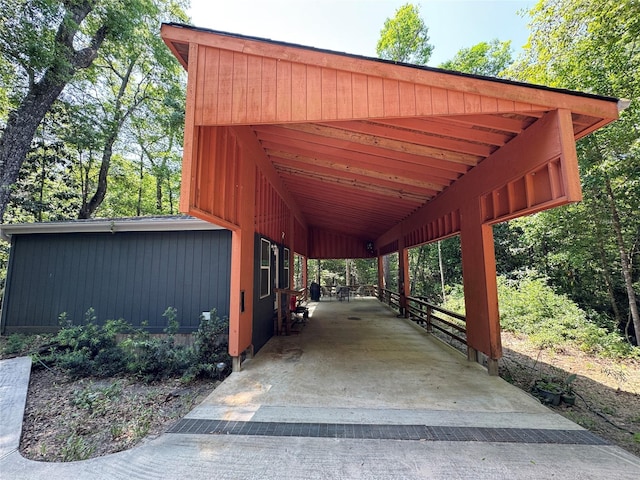 surrounding community featuring an attached carport and driveway