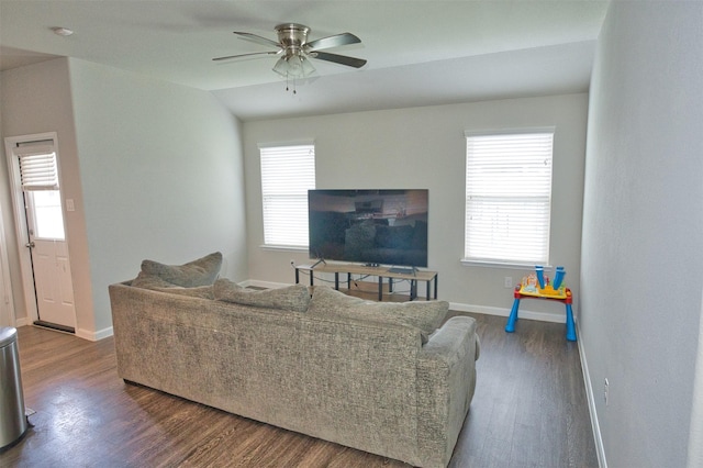 living area featuring wood finished floors, baseboards, and plenty of natural light