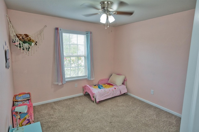 bedroom with carpet flooring, baseboards, and a ceiling fan