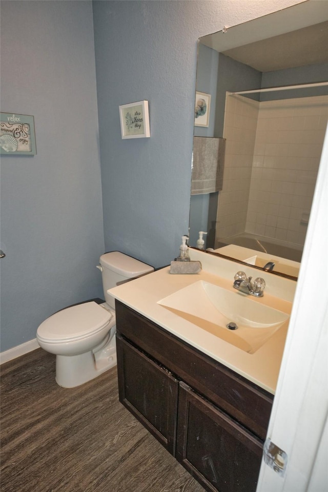 bathroom with vanity, walk in shower, and toilet