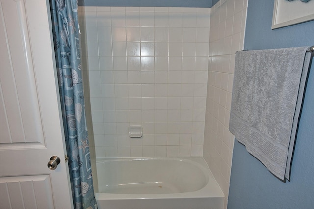 bathroom with shower / bath combo with shower curtain