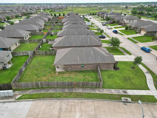 birds eye view of property with a residential view