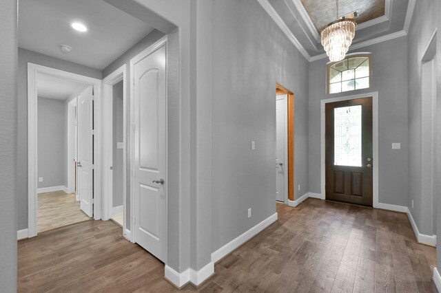 114 Winecup Cir, Montgomery, TX 77316 - foyer with hardwood / wood-style floors, baseboards, and a chandelier