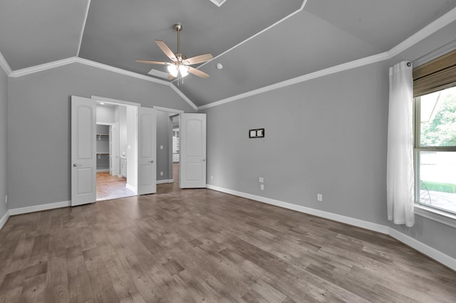 114 Winecup Cir, Montgomery, TX 77316 - unfurnished bedroom with lofted ceiling, wood finished floors, baseboards, and ornamental molding