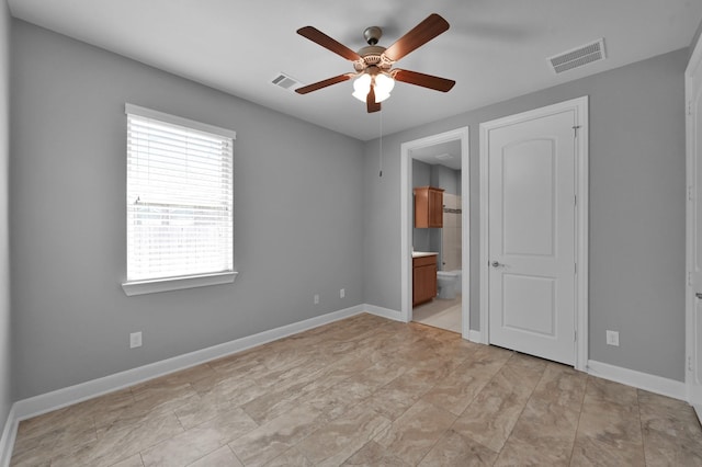 114 Winecup Cir, Montgomery, TX 77316 - unfurnished bedroom with visible vents, baseboards, ceiling fan, and ensuite bathroom