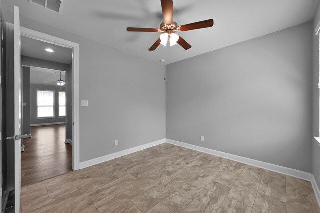 114 Winecup Cir, Montgomery, TX 77316 - unfurnished room featuring baseboards, a ceiling fan, and visible vents
