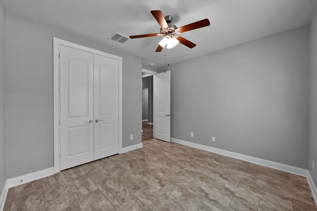 114 Winecup Cir, Montgomery, TX 77316 - unfurnished bedroom featuring a closet, baseboards, a ceiling fan, and visible vents