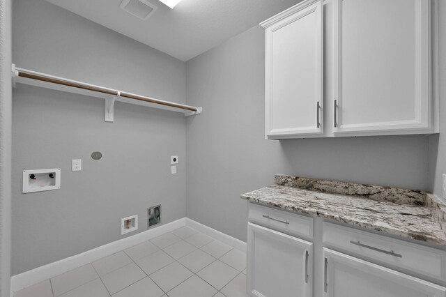 114 Winecup Cir, Montgomery, TX 77316 - laundry room with visible vents, light tile patterned floors, washer hookup, cabinet space, and electric dryer hookup