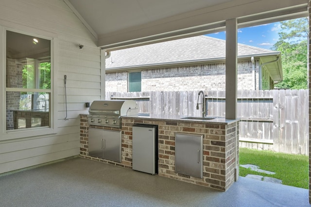114 Winecup Cir, Montgomery, TX 77316 - view of patio / terrace with an outdoor kitchen, fence, a sink, and area for grilling