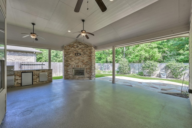 114 Winecup Cir, Montgomery, TX 77316 - view of patio / terrace with a fenced backyard, exterior kitchen, and an outdoor brick fireplace