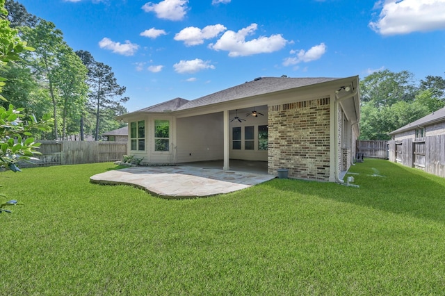 114 Winecup Cir, Montgomery, TX 77316 - rear view of house with a lawn, ceiling fan, and a fenced backyard