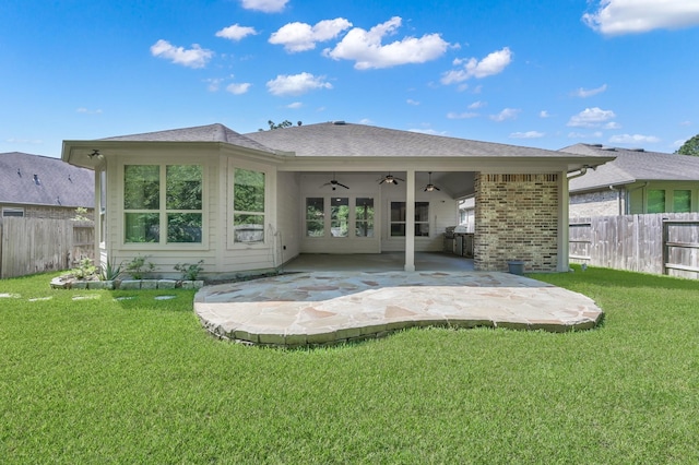 114 Winecup Cir, Montgomery, TX 77316 - back of house featuring fence, ceiling fan, a lawn, and a patio area