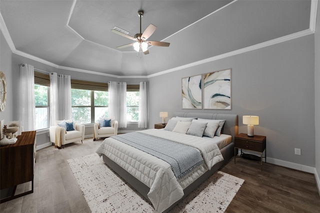 114 Winecup Cir, Montgomery, TX 77316 - bedroom featuring baseboards, wood finished floors, ceiling fan, crown molding, and a raised ceiling