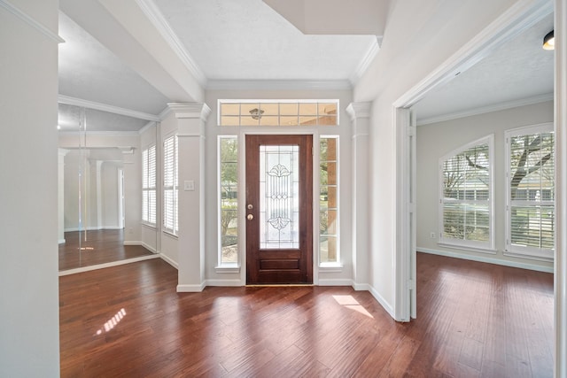 6214 Laguna Del Rey Dr, Houston, TX 77041 - foyer featuring crown molding, baseboards, decorative columns, and wood finished floors