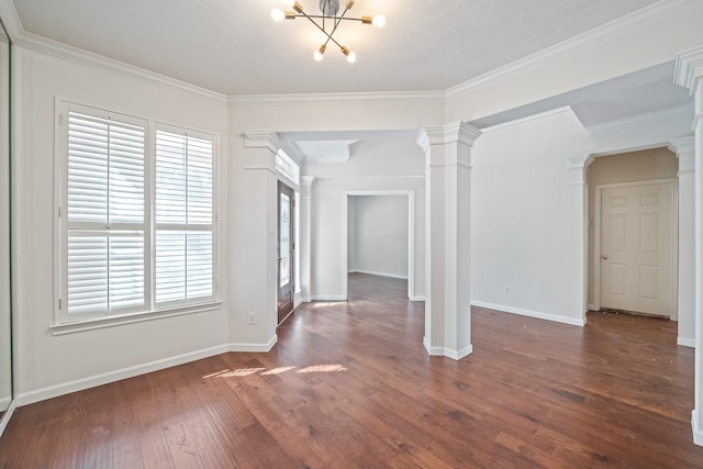 6214 Laguna Del Rey Dr, Houston, TX 77041 - unfurnished dining area featuring a notable chandelier, ornate columns, baseboards, and dark wood finished floors