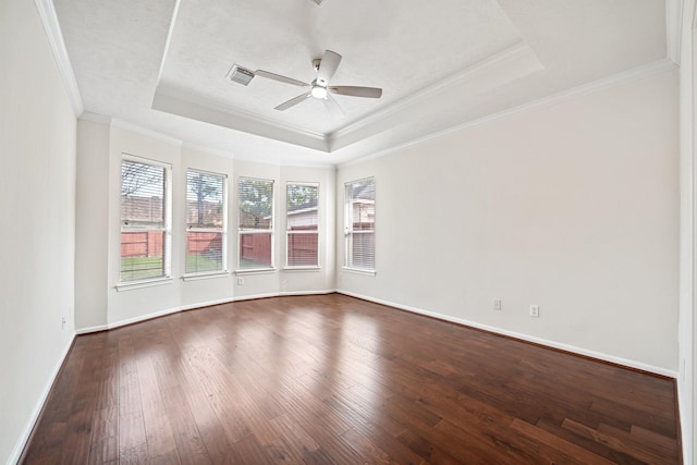 6214 Laguna Del Rey Dr, Houston, TX 77041 - unfurnished room featuring dark wood-type flooring, a tray ceiling, a ceiling fan, and ornamental molding