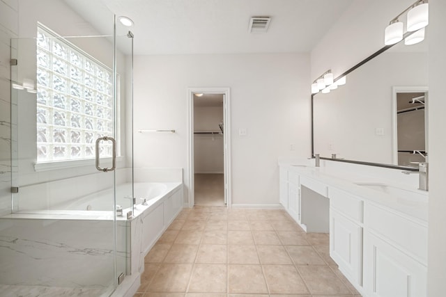 6214 Laguna Del Rey Dr, Houston, TX 77041 - full bathroom featuring double vanity, visible vents, a sink, and a stall shower