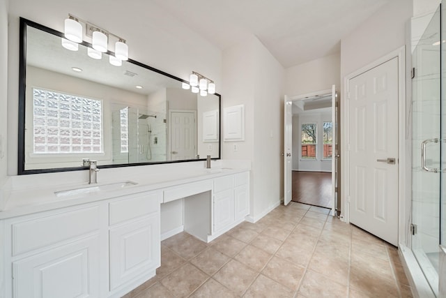 6214 Laguna Del Rey Dr, Houston, TX 77041 - bathroom featuring tile patterned flooring, double vanity, a sink, and a stall shower