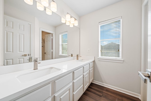 6214 Laguna Del Rey Dr, Houston, TX 77041 - full bathroom with a sink, baseboards, double vanity, and wood finished floors
