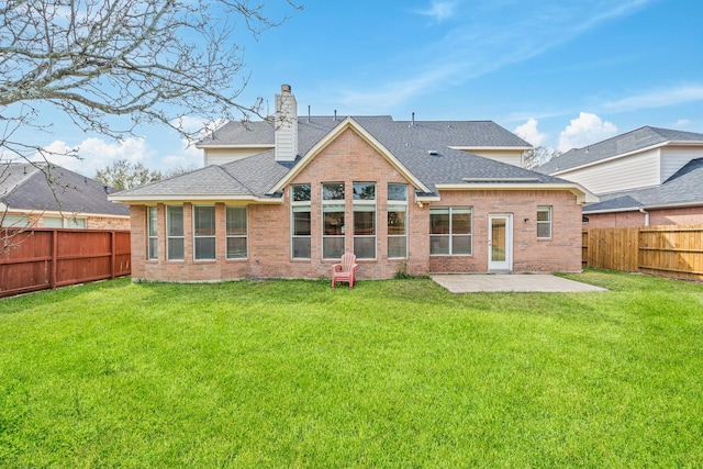 6214 Laguna Del Rey Dr, Houston, TX 77041 - back of house featuring a patio, roof with shingles, brick siding, a fenced backyard, and a lawn