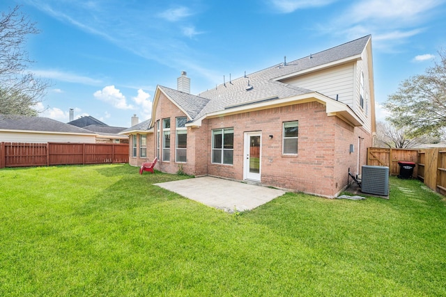 6214 Laguna Del Rey Dr, Houston, TX 77041 - back of house with central AC unit, a lawn, a chimney, a fenced backyard, and brick siding
