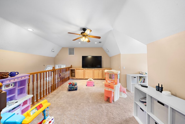 recreation room featuring visible vents, ceiling fan, carpet floors, and lofted ceiling