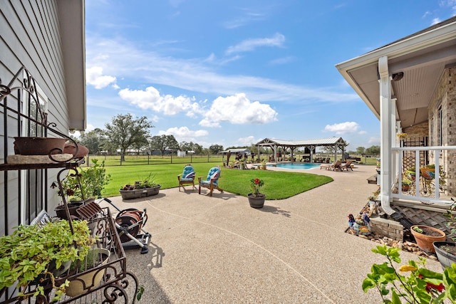 view of patio featuring a pergola, a gazebo, a fire pit, and an outdoor pool