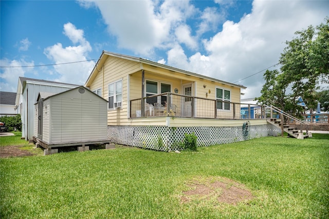 120 W Main St, Port O Connor, TX 77982 - back of house with a shed, a lawn, and a wooden deck
